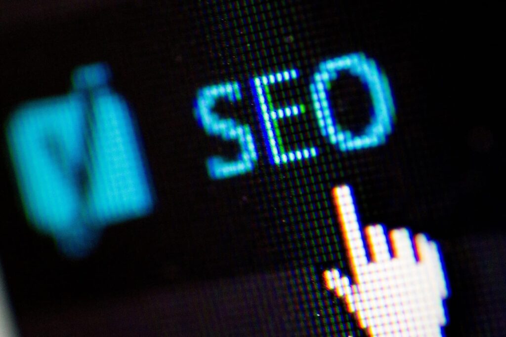 An image showing a mouse hovering over a button, signifying a user driving traffic through SEO.