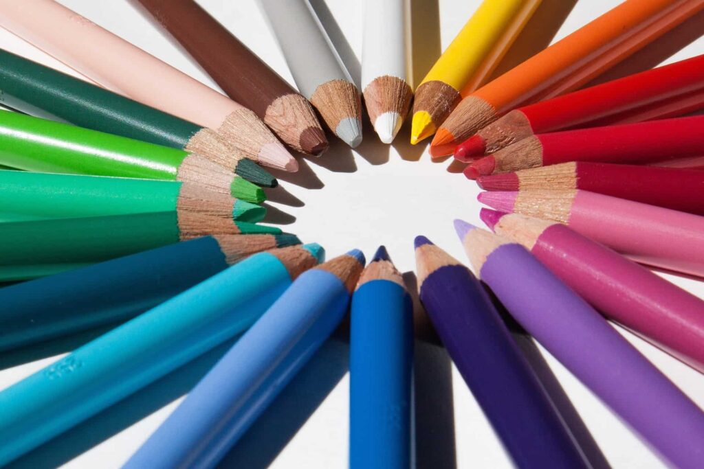 Coloured pencils in a circle to signify creating engaging visual content